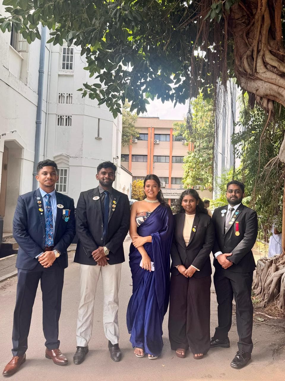 Club officers in formal dress at a district event